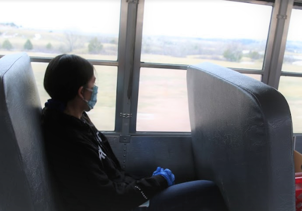 Masked student on a bus
