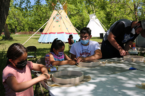 Red Cloud's Lakota Language Camp gathered in a circle