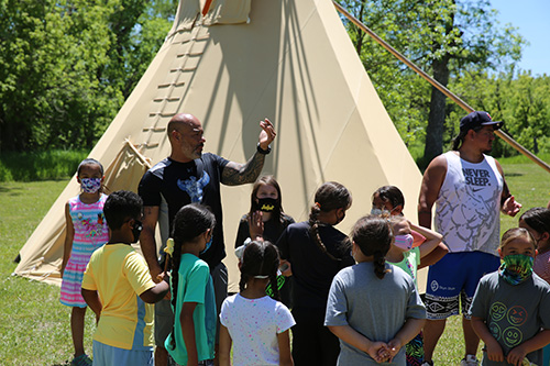 Red Cloud's Lakota Language Camp gathered in a circle